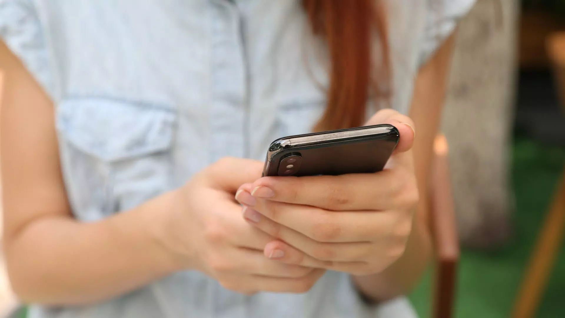 woman on a smartphone managing her insurance policy