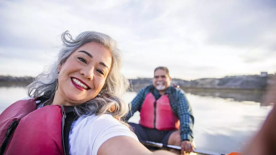 Happy couple enjoying a canoe ride