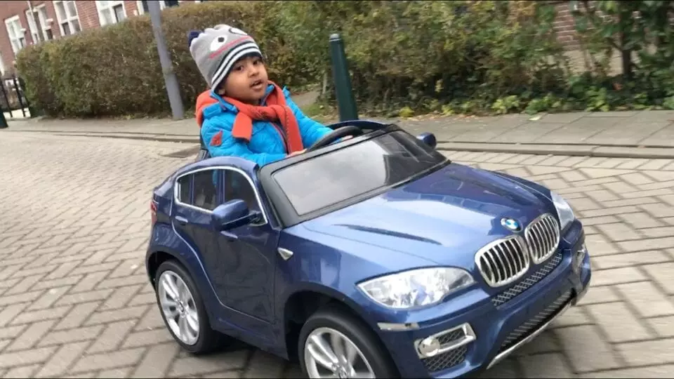 Toddler in a toy car