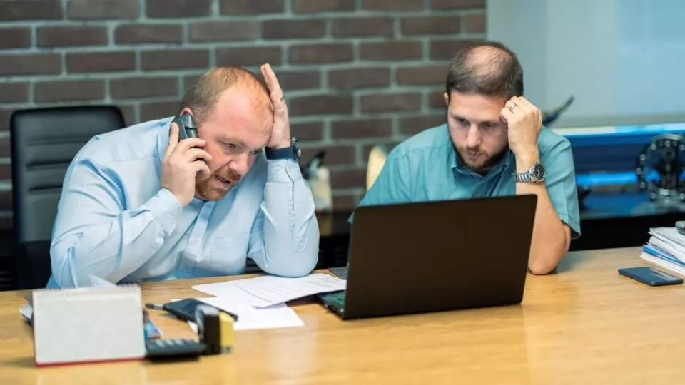Business colleagues stressed over cyber security attack