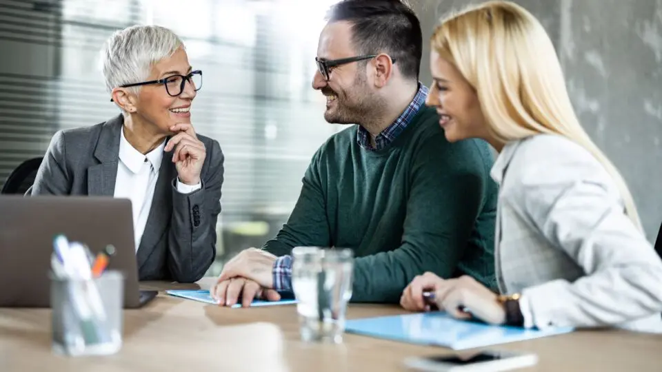 Couple discussion critical illness insurance with an advisor