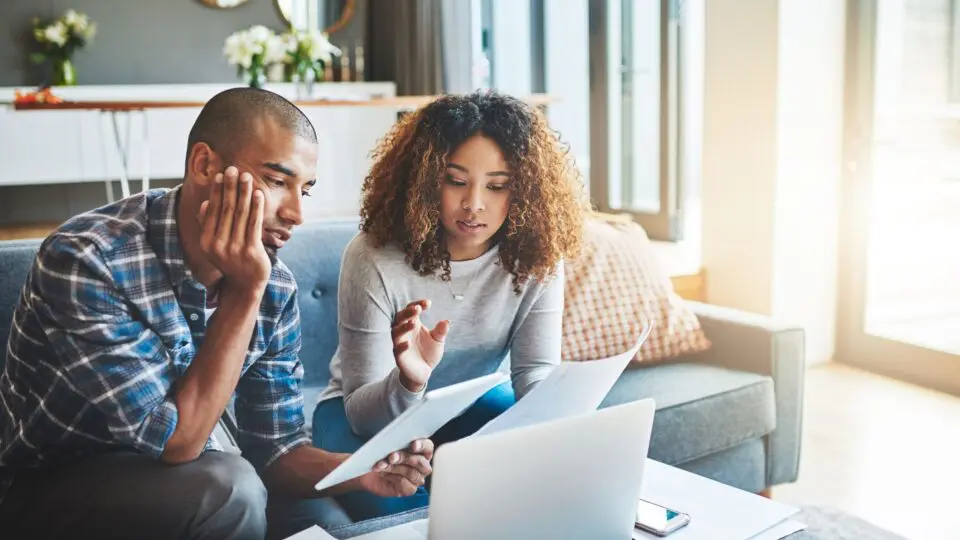 Couple considering how to switch their home insurance
