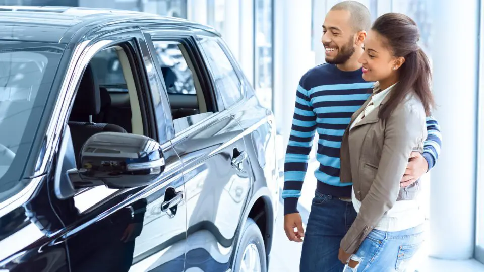 a couple considering an SUV or a sedan