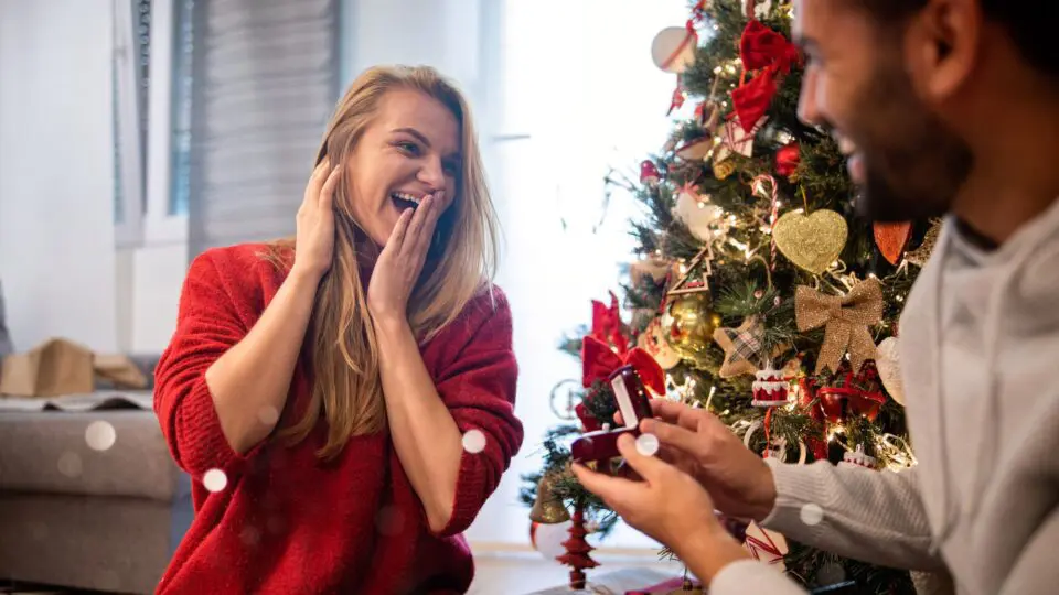 Feamle getting a jewelry gift for Christmas