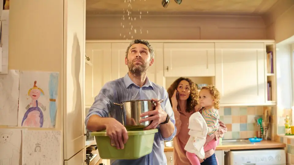 Homeowners with burst water pipes damage