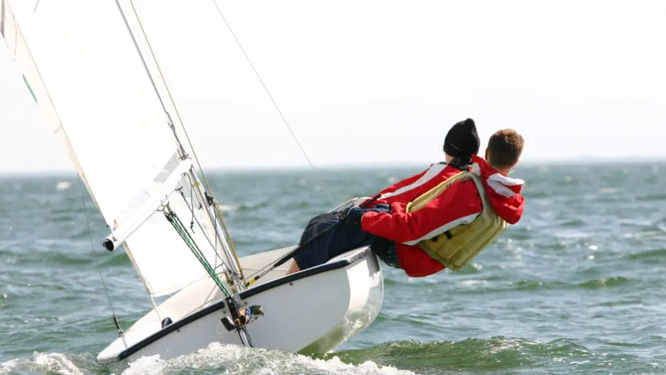 Image of two sailers and their boat