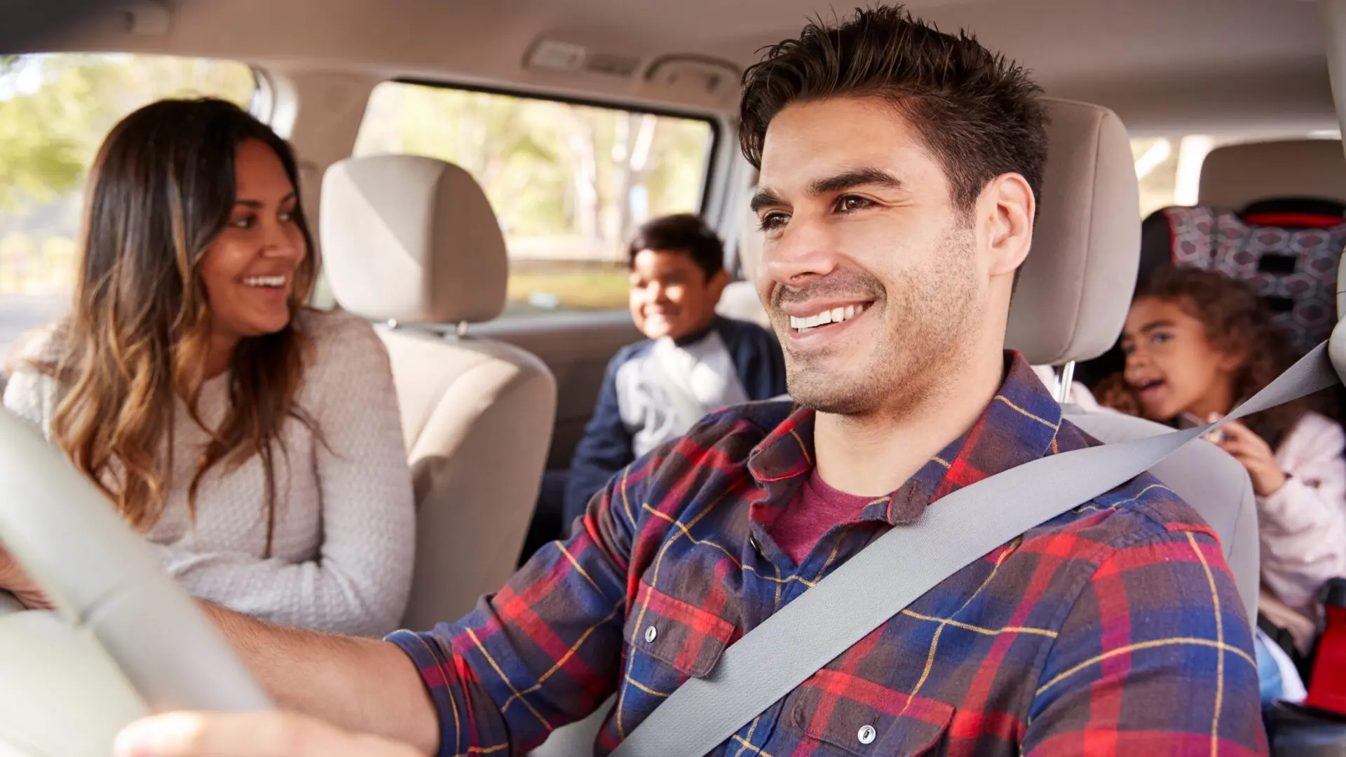 family driving in their car