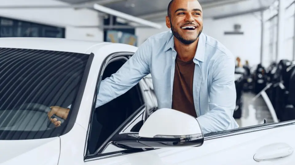 Man buying a new car