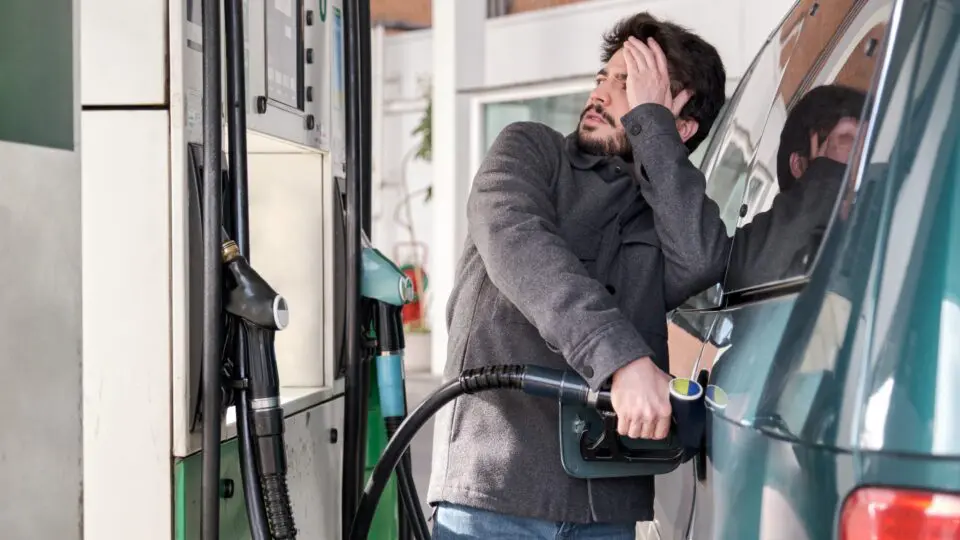 Man pumping gas into car