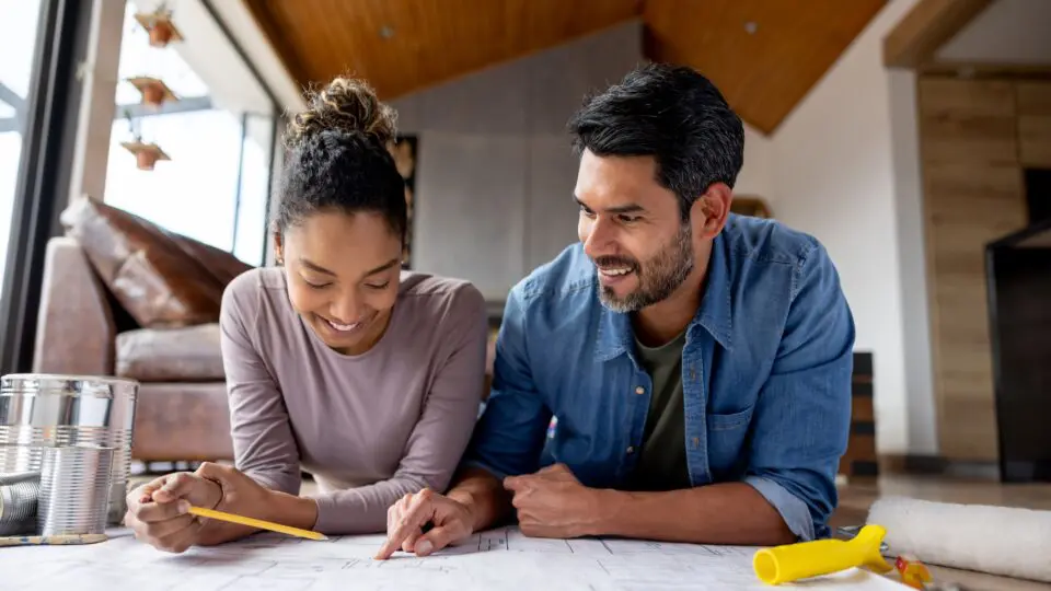 A couple reviewing home renovation plans