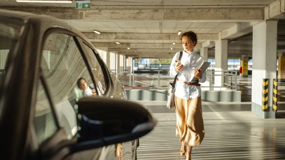 female sales person getting into a car