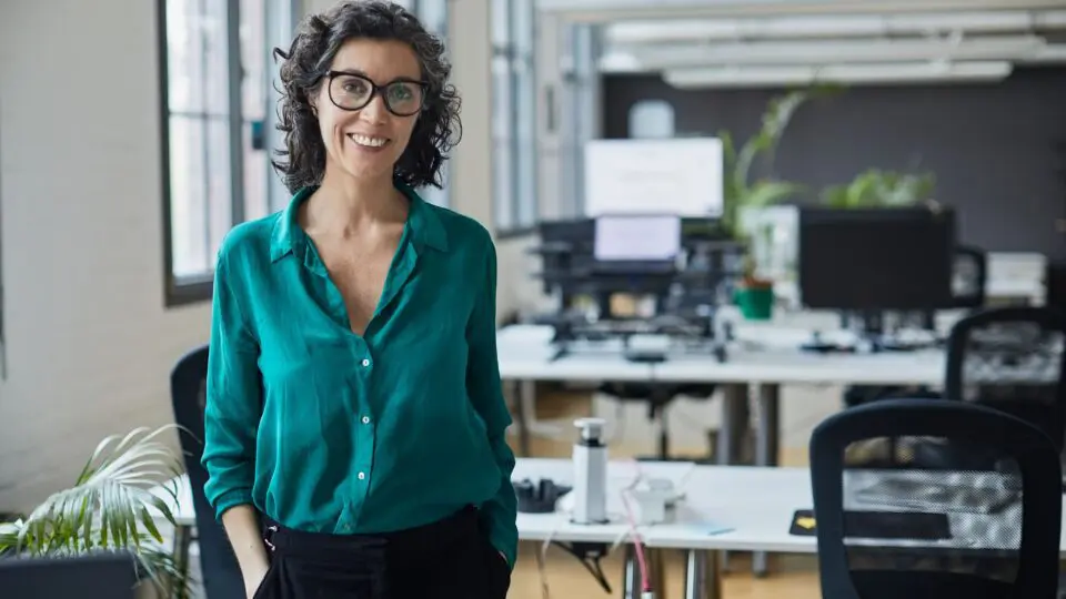 A female small business owner at her offices before her employees arrive