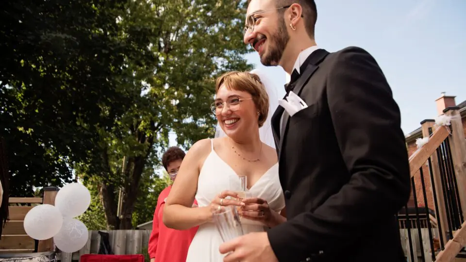 A couple celebrating a backyard wedding