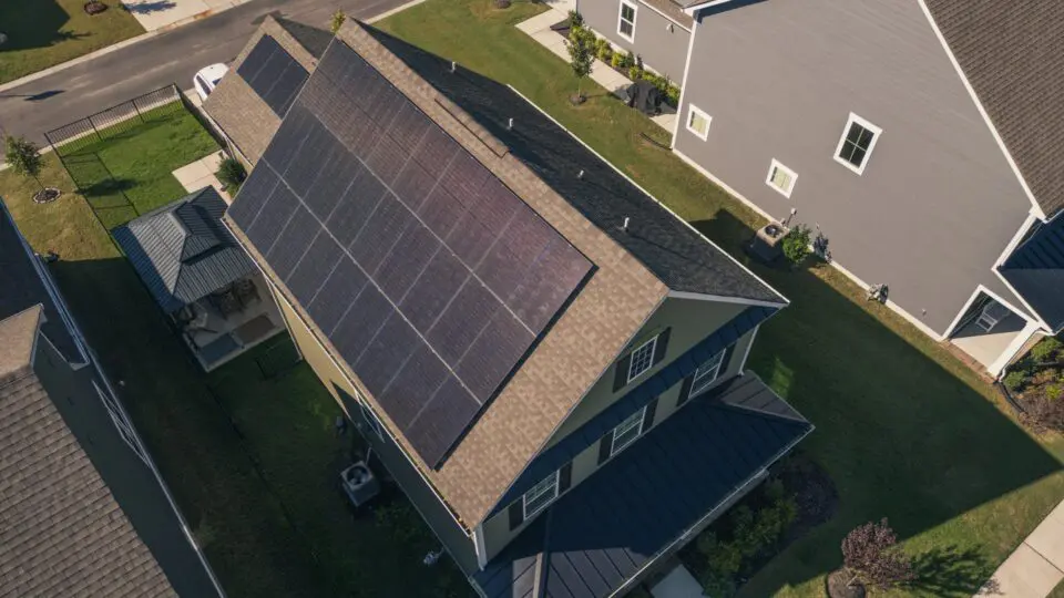 aerial view of a home roof with solar panels