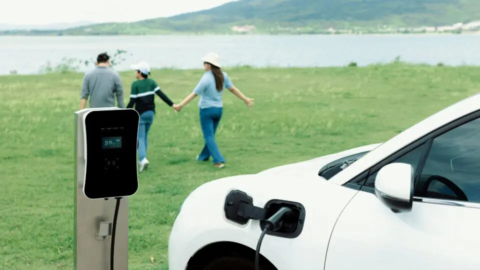 An EV car recharging on a road trip