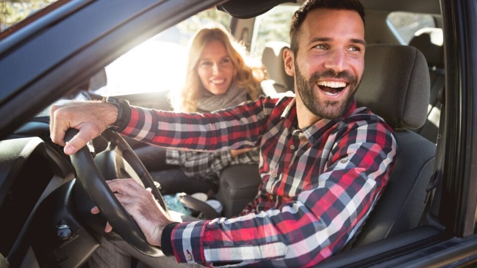 Couple happy knowing they have the Car Insurance they need