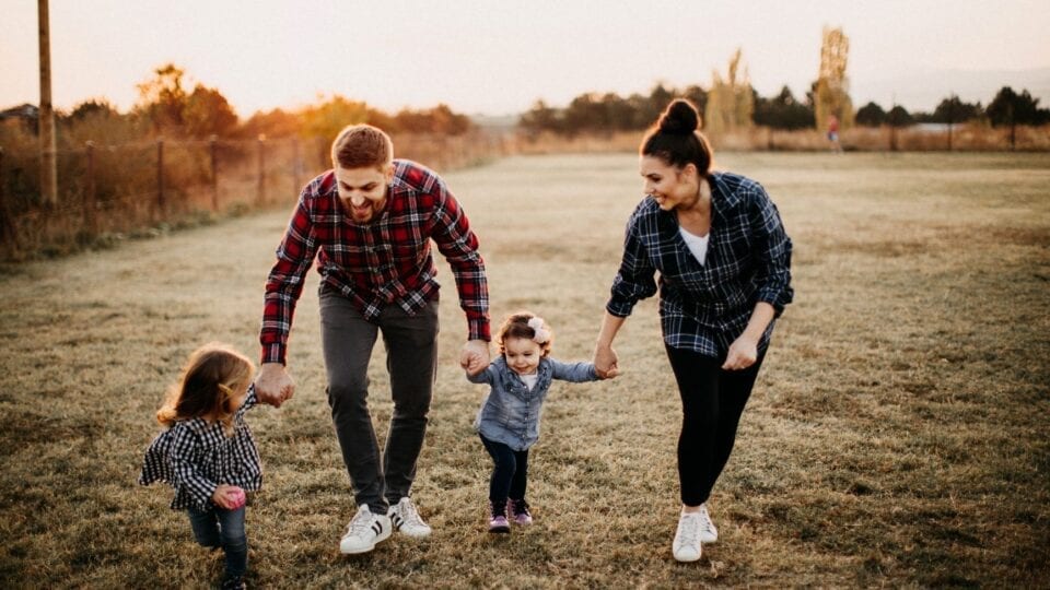 young family enjoying a walk together