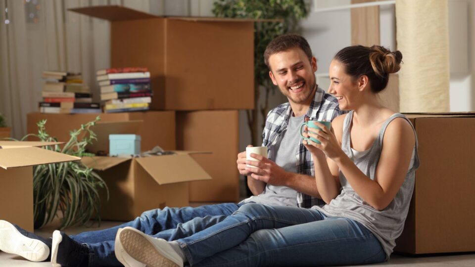 Tenants relaxing after moving in to their apartment