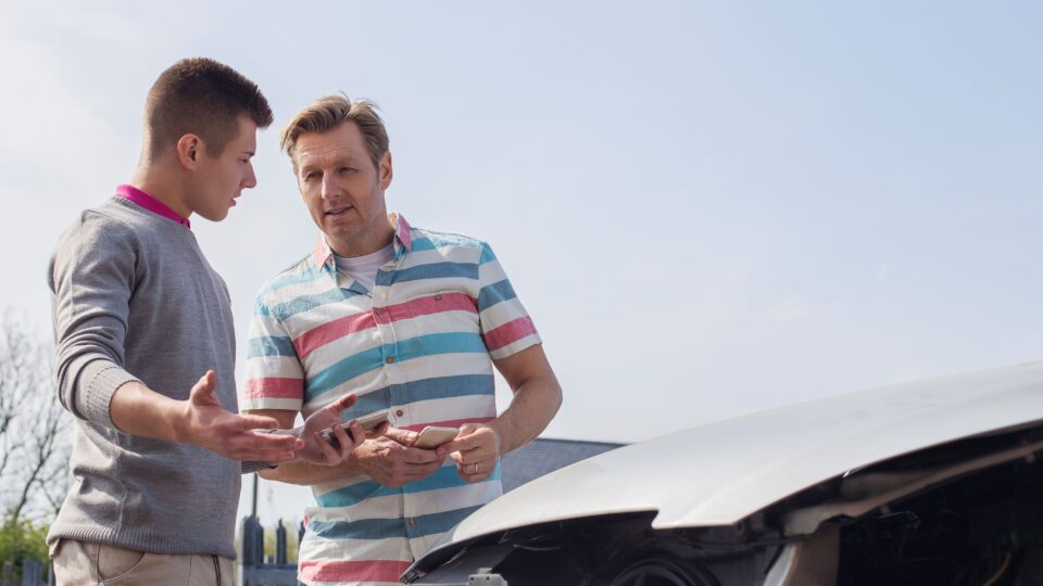 Two men discussing a car accident