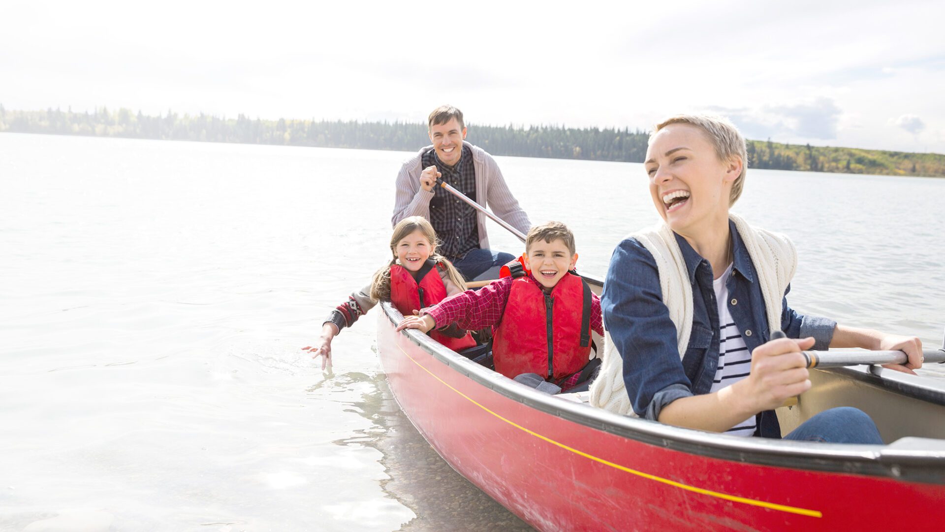 Family enjoying canoe ride