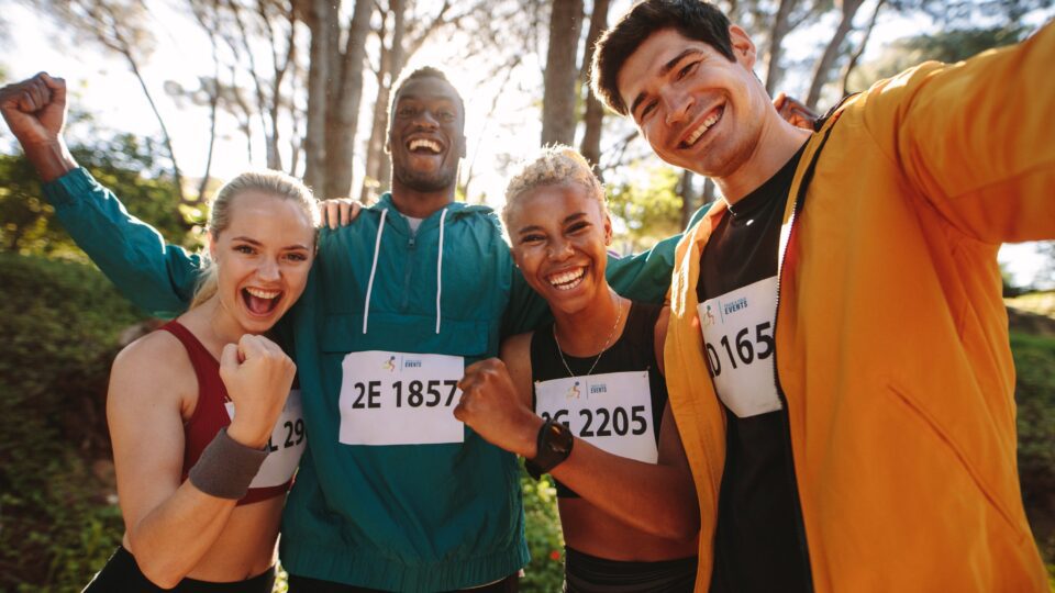 a group of runners celebrating after a race