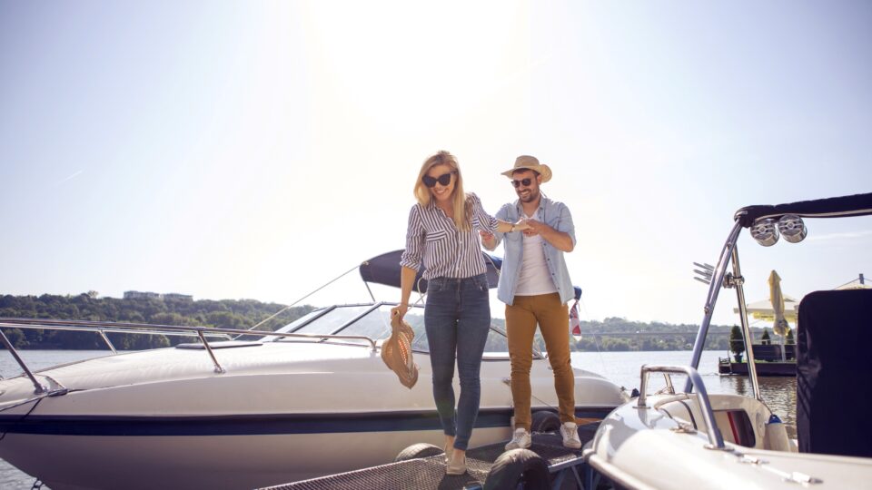 A couple walking off a docked boat