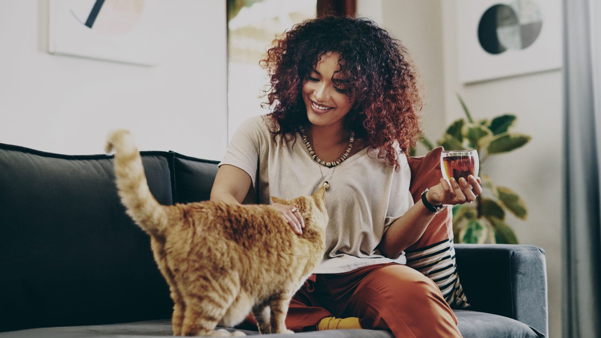 Female with a cat in her apartment