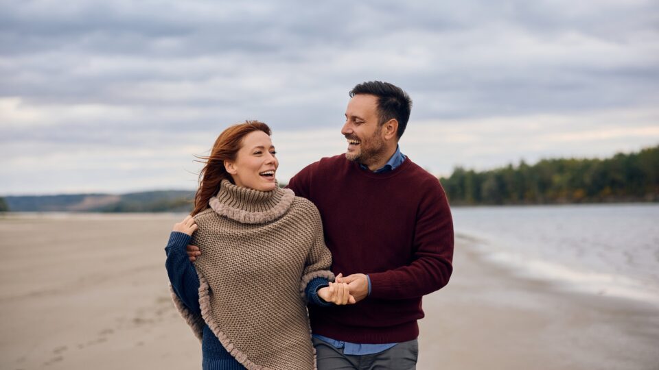 A couple walking on a beach